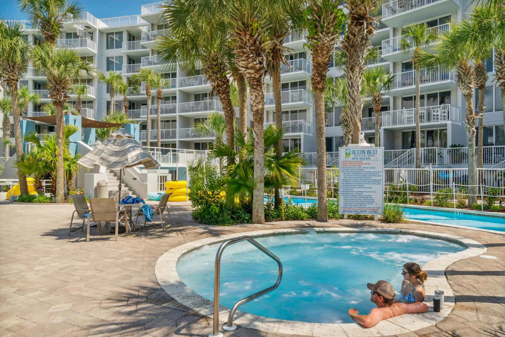A resort hot tub surrounded by palm trees