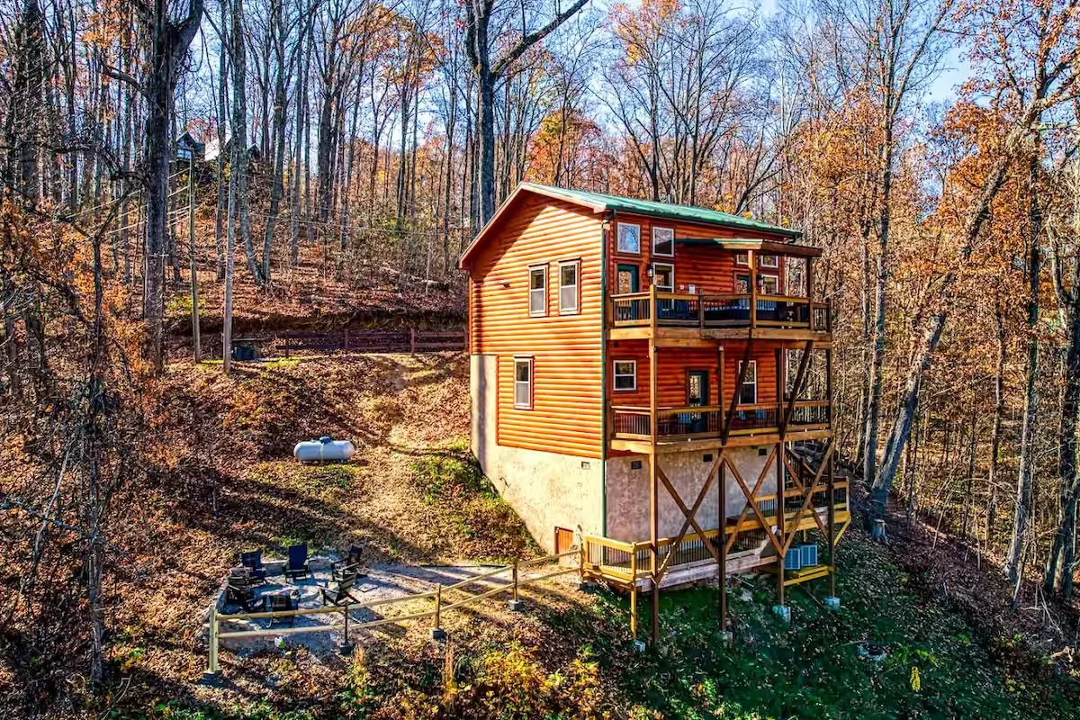 Jackalopia log cabin tucked into a wooded mountainside