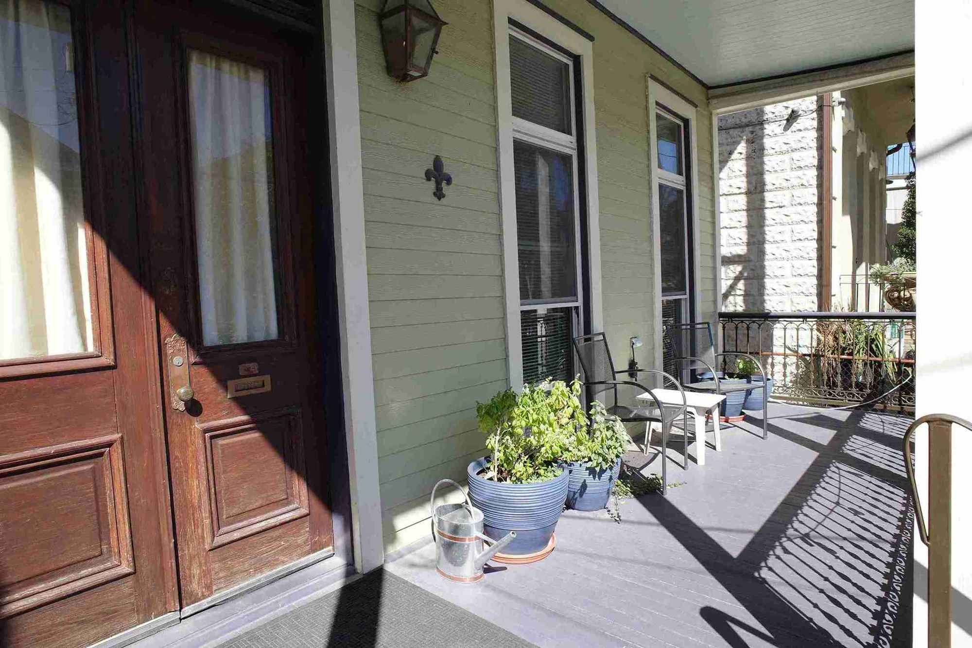 The welcoming porch of the historic Mid-City New Orleans home
