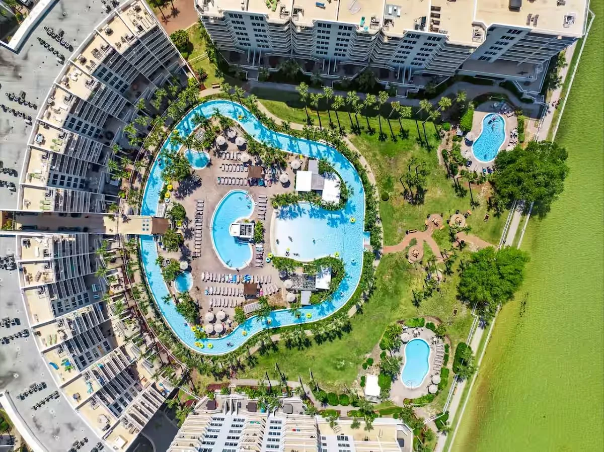 Aerial view of the pools and lazy river at Destin West Beach and Bay Resort